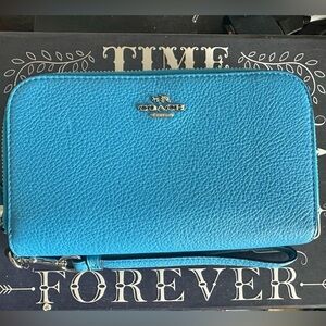 Blue Coach double zip wristlet.